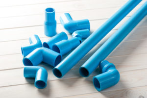 blue-colored PVC pipe and fittings